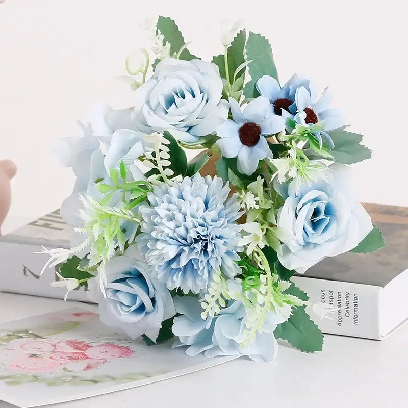 A delicate bouquet of light blue silk fake flowers featuring blue peony and tea rose for home garden decor