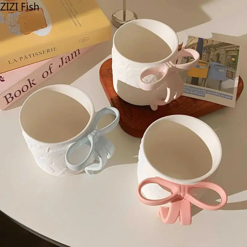 White ceramic bowknot ceramic mug and saucer set in pastel pink and blue for decorbites dining room tea use
