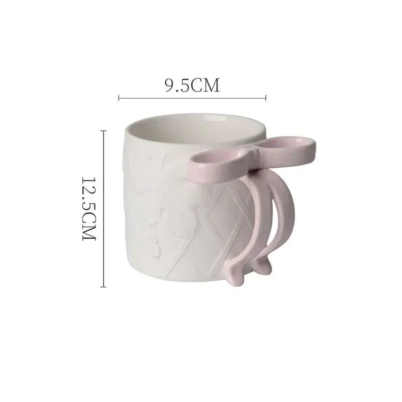 White decorbites bowknot ceramic mug with pink bow handle and textured pattern in saucer set for dining room tea cup