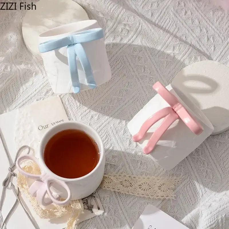 White ceramic bowknot ceramic mug saucer set with blue and pink pastel bows by decorbites for dining room tea use