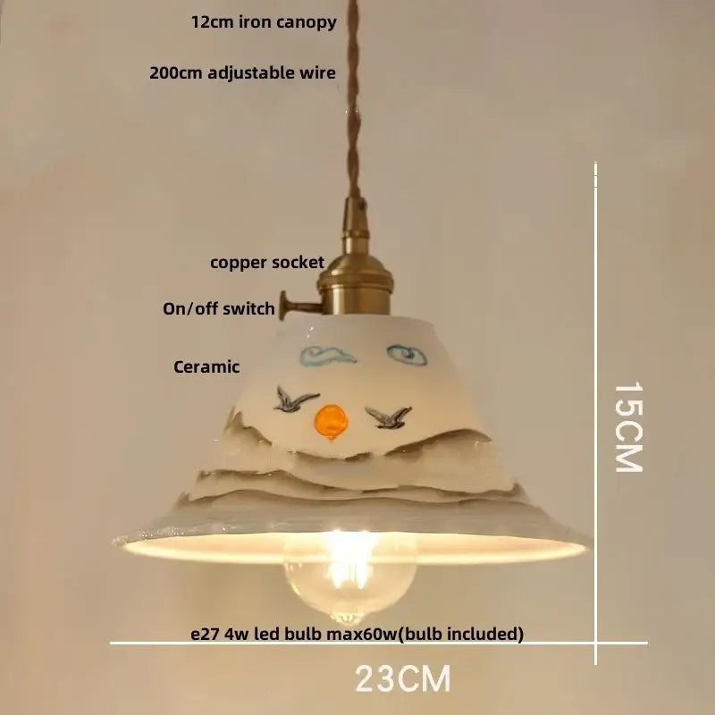 Blue ribbed ceramic led pendant lamp with brass accents featuring a charming hand-painted face design decorbites ceramic led