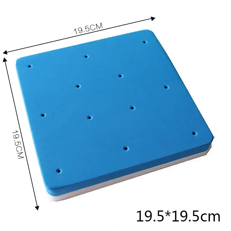 Blue square foam cake shaping mat with white underside and evenly spaced holes for precise cake shaping