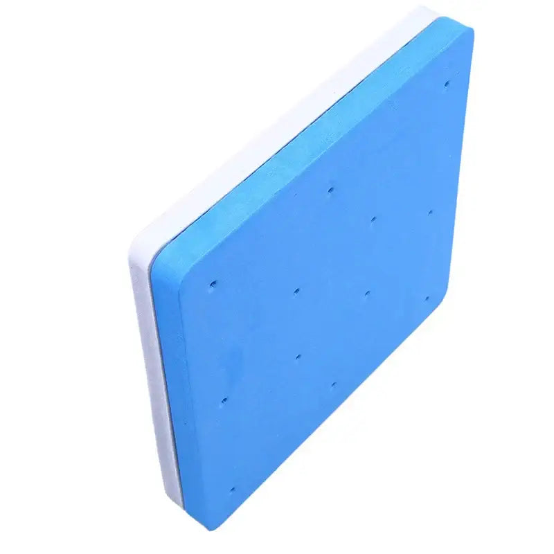Blue and white foam cake shaping mat with evenly spaced holes for precise cake shaping and dessert crafting use