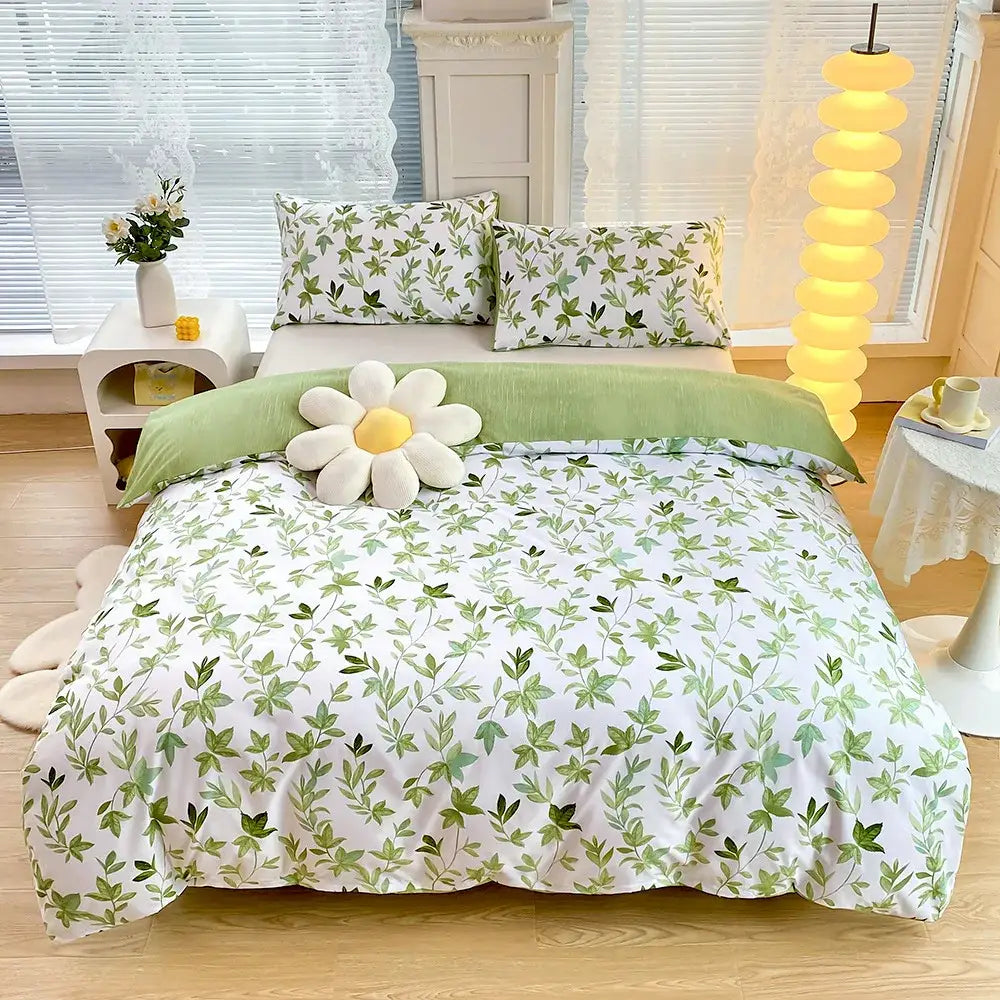 Blue starry sky duvet cover set with white and green leaf-patterned bedding and plush white daisy pillow on top
