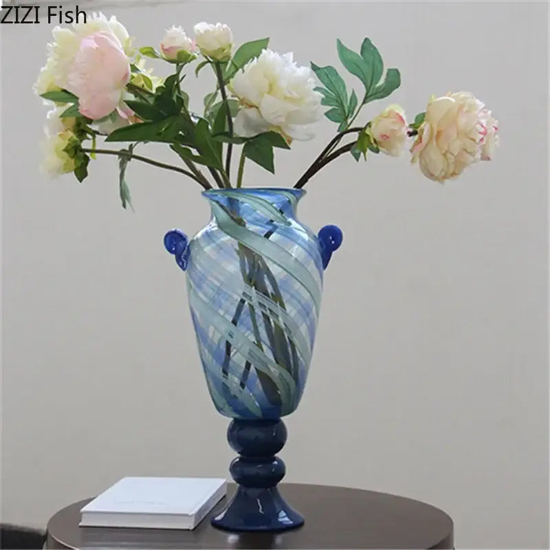 Blue stripe glass vase with swirling light and dark blue patterns and two small side handles for hydroponic plants