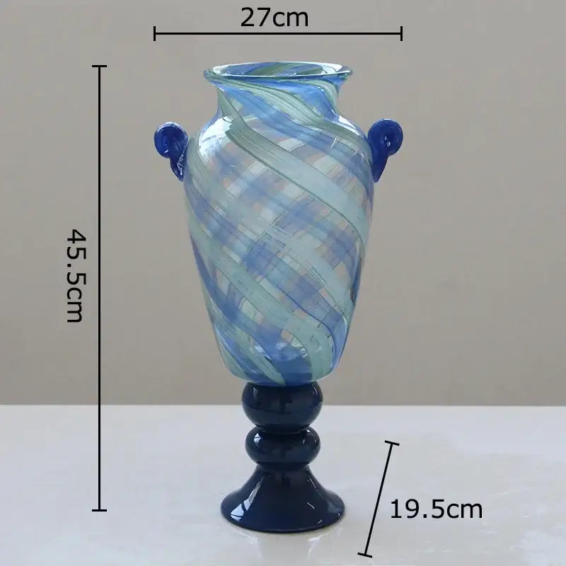 A tall blue stripe glass swirl vase with dark blue handles and pedestal base for living room hydroponic plant decorbites blue stripe