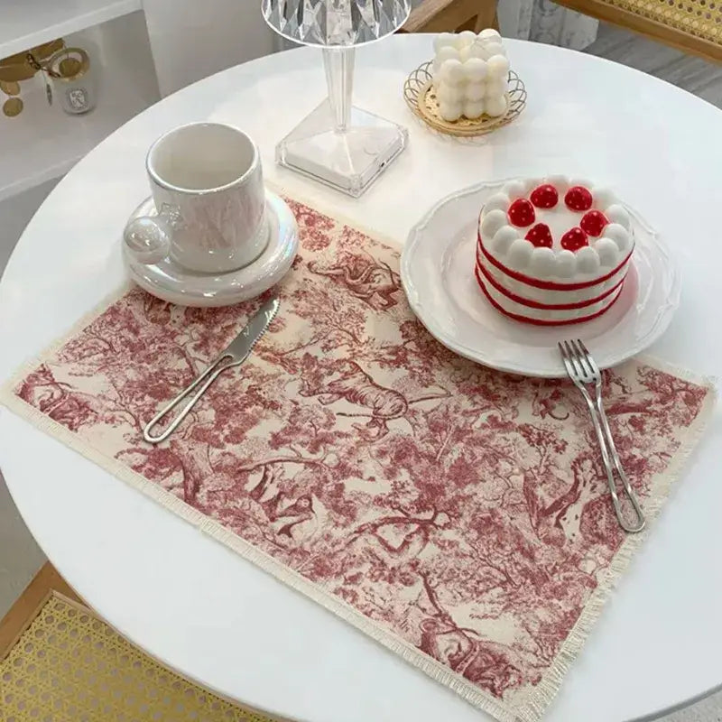 A blue toile cotton linen meal mat with a vintage red and cream pattern and frayed edges for dining room decorbites cotton linen