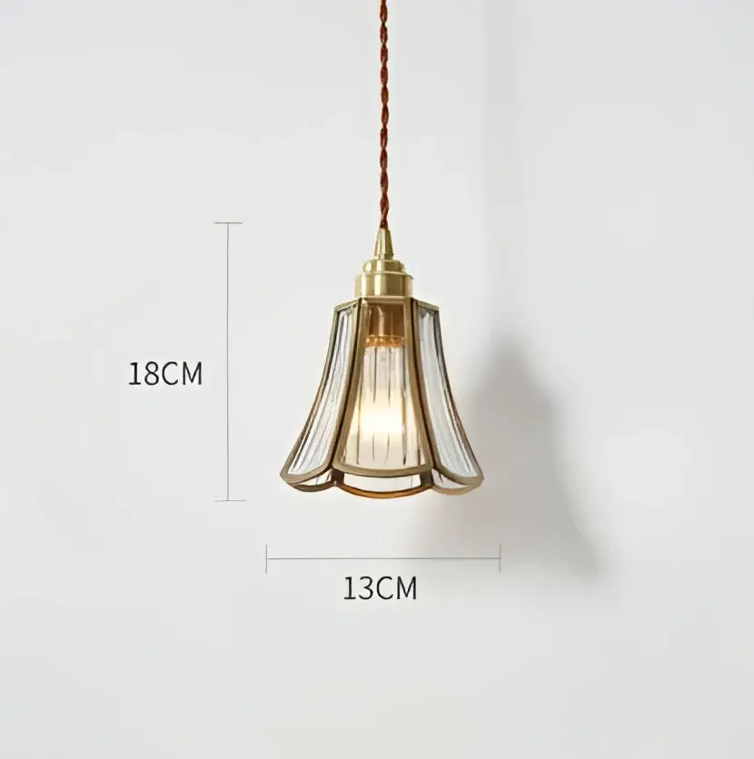 A delicate blue translucent glass pendant light with brass fixture and braided cord by decorbites pendant lights