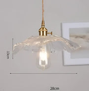 Blue translucent glass pendant light with brass fixture and exposed bulb ideal for bedroom decorbites pendant lights
