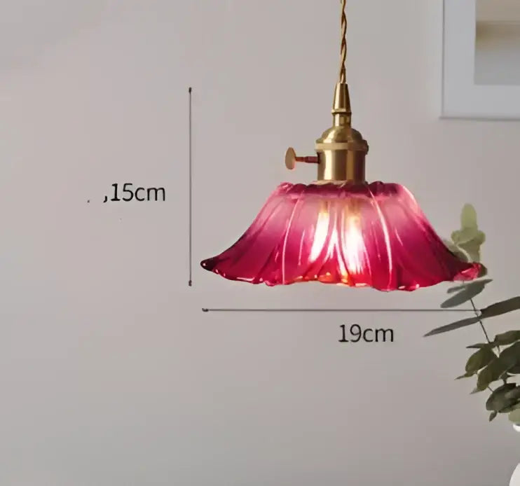 A vibrant red petal-shaped glass pendant light with brass fixture for bedroom decorbites pendant lights