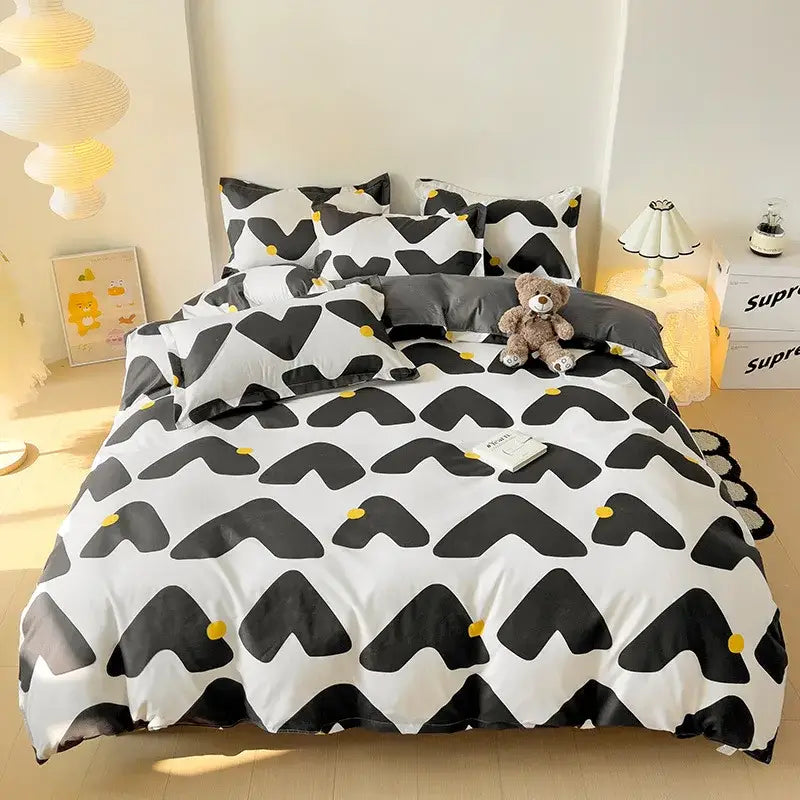 Blue white blocking print bedding set featuring a white and black geometric pattern with yellow accents for decorbites blue white collection
