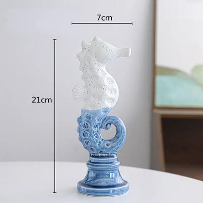 Blue and white cartoon seahorse ceramic statue with speckled upper body and ornate base decorbites cartoon seahorse decor