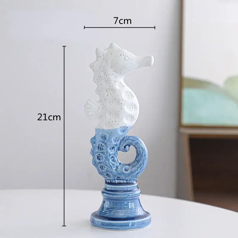 Blue and white cartoon seahorse ceramic statue with speckled upper body and ornate base decorbites cartoon seahorse decor
