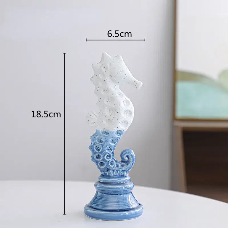 Delicate blue and white cartoon seahorse ceramic statue with speckled finish on ornate base for living room decorbites decor