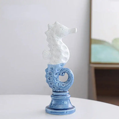 Blue and white cartoon seahorse ceramic statue with intricate patterns on a matching pedestal base for living room decorbites