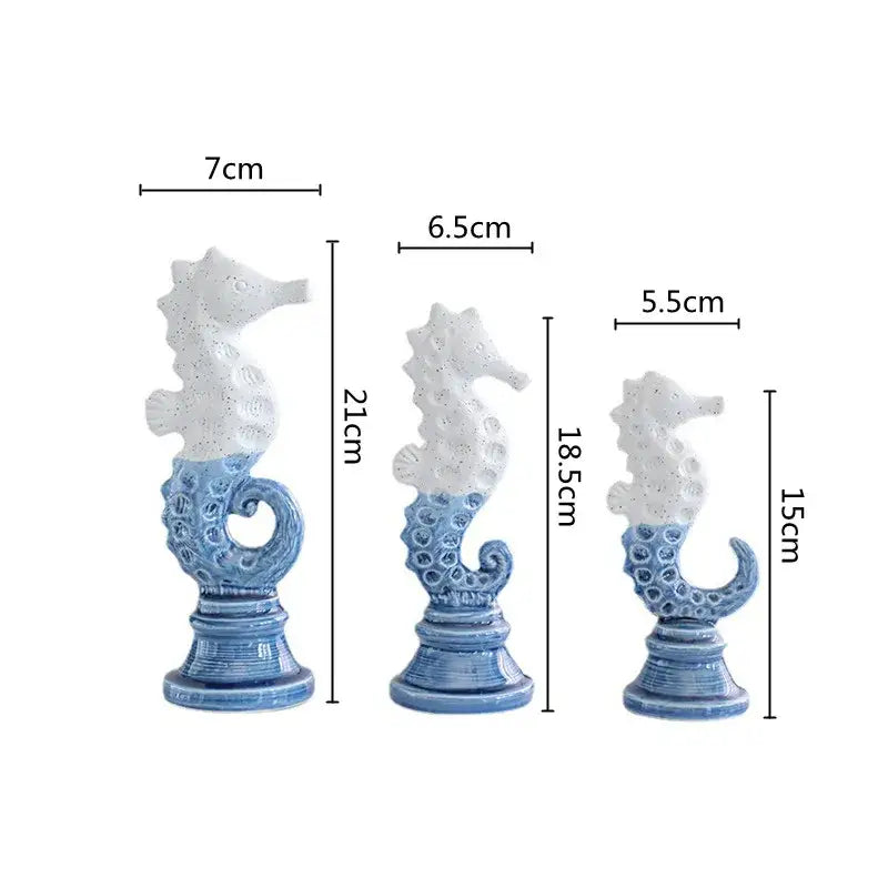 Three blue and white cartoon seahorse ceramic statues with textured bases for living room decor by Decorbites