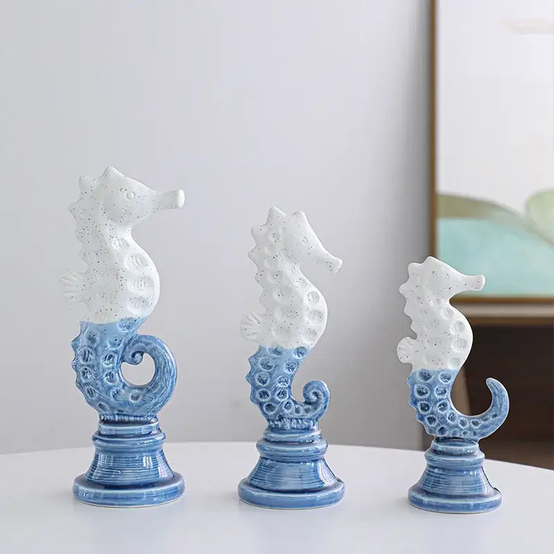 Three blue and white cartoon seahorse ceramic statues with intricate texture for living room decor by decorbites