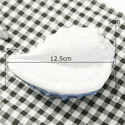 White ceramic marine life clamshell tray with speckled finish and blue glazed rim for decorbites ceramic marine decor