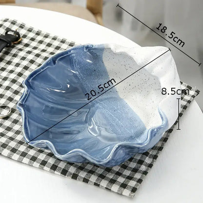 A ceramic marine life clamshell tray with scalloped edges and blue to white gradient glaze for bedroom decorbites decor