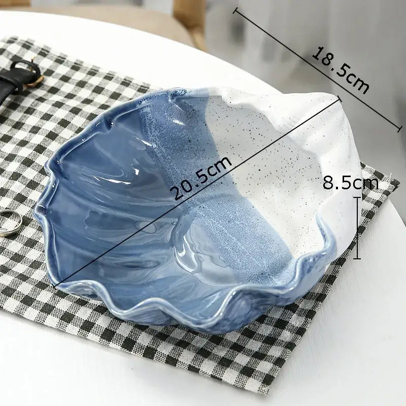 A ceramic marine life clamshell tray with scalloped edges and blue to white gradient glaze for bedroom decorbites decor