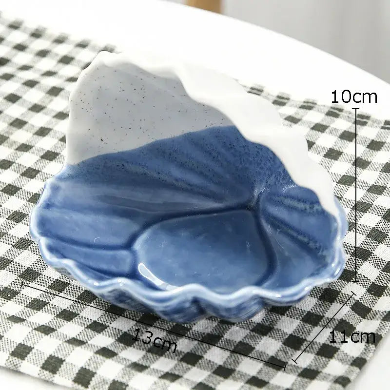 Blue and white ceramic marine life clamshell tray shaped like a leaf with textured glossy glaze for decorbites ceramic marine decor