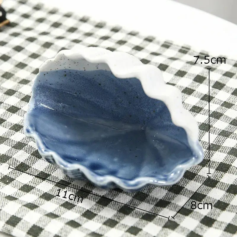 A ceramic marine life clamshell tray with glossy blue interior and white scalloped edges for decorbites ceramic marine decorbites ceramic marine life bedroom decor