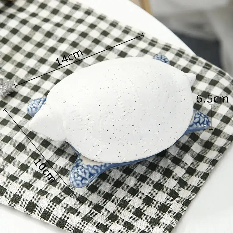 White ceramic marine life turtle figurine with blue patterned legs and speckled shell for decorbites ceramic marine decor