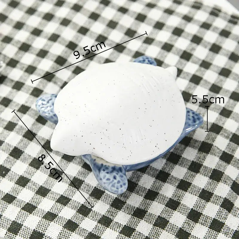 White ceramic turtle figurine with blue speckled shell and textured surface for decorbites ceramic marine life decorbites ceramic marine life
