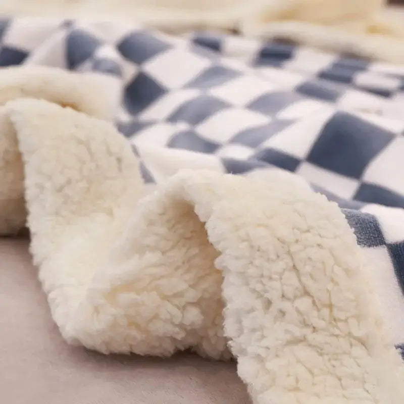 Cream-colored sherpa fleece blanket with blue and white lamb wool checkered double layer for bedroom throw use