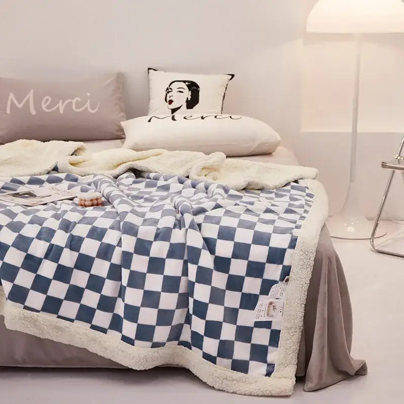 Blue and white double layer lamb wool checkered fleece blanket with a soft plush texture perfect as a bedroom throw