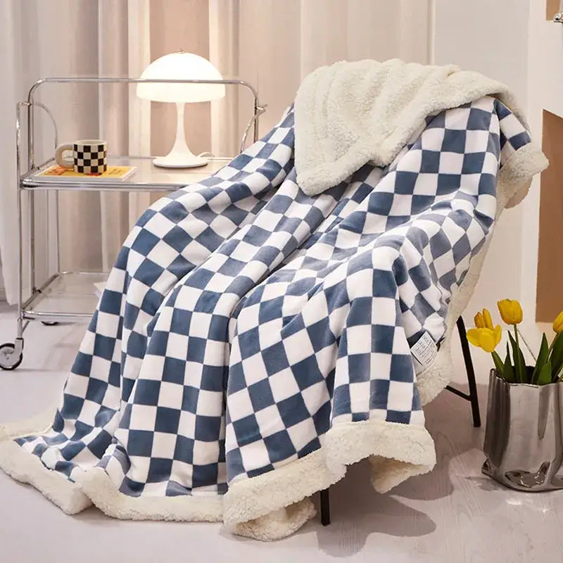 Blue and white checkered bedroom throw with plush cream fleece lining made of double layer lamb wool checkered fabric