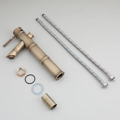 Brass bamboo-style bathroom faucet with matching hoses and fittings for blue and white porcelain basin set with pop drain