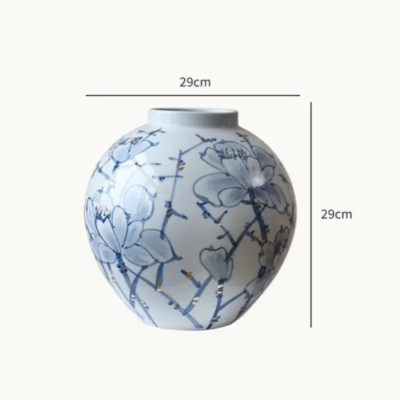 A 29cm tall round white porcelain ceramic vase with blue floral patterns and gold accents for living room decorbites decor