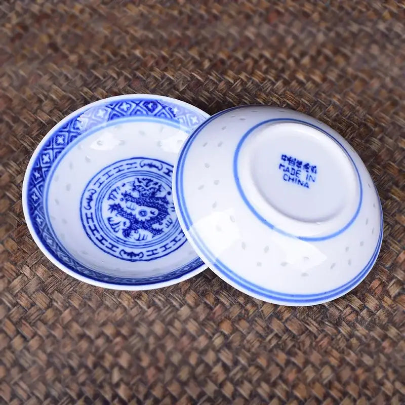 Blue and white porcelain dragon pattern dish set featuring an intricate dragon design for dining room use