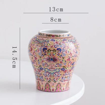 A decorative blue white porcelain floral vase with intricate pink yellow and green scrollwork for living room decor