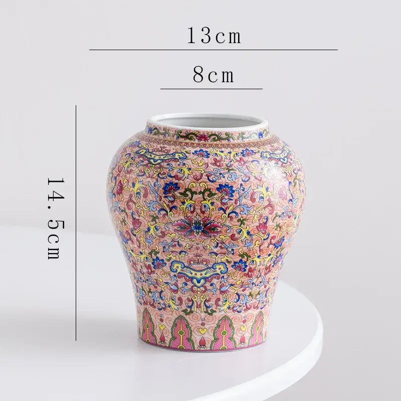 A decorative blue white porcelain floral vase with intricate pink yellow and green scrollwork for living room decor