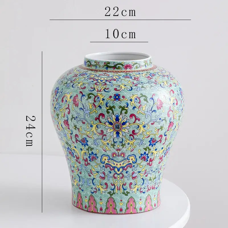 A decorative blue white porcelain floral vase with intricate pink yellow green and gold patterns for living room decor