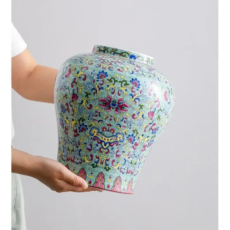 A vibrant blue white porcelain floral vase with intricate pink, yellow, and green decorbites blue white patterns