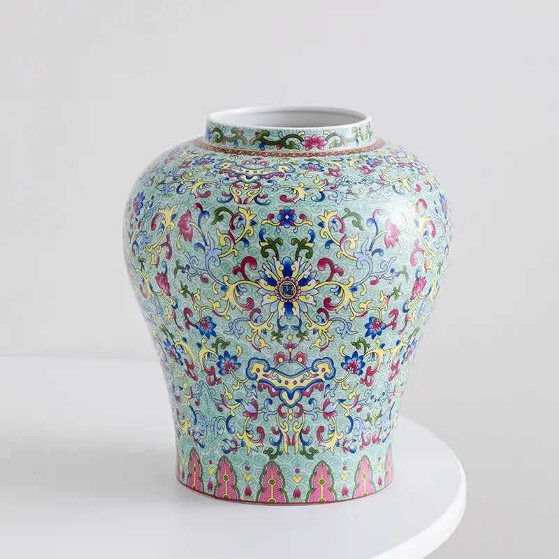 A vibrant turquoise blue white porcelain floral vase with intricate pink yellow and green scrollwork for living room decorbites decor