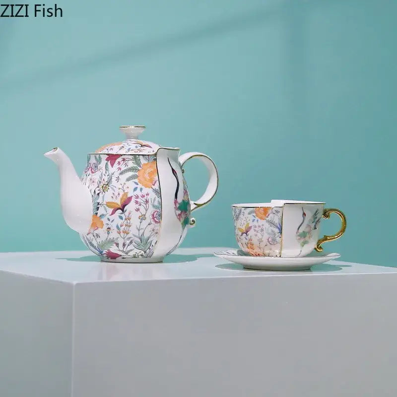 Delicate blue white porcelain coffee mug and teacup set with floral orange blossoms purple flowers and gold trims decorbites blue white