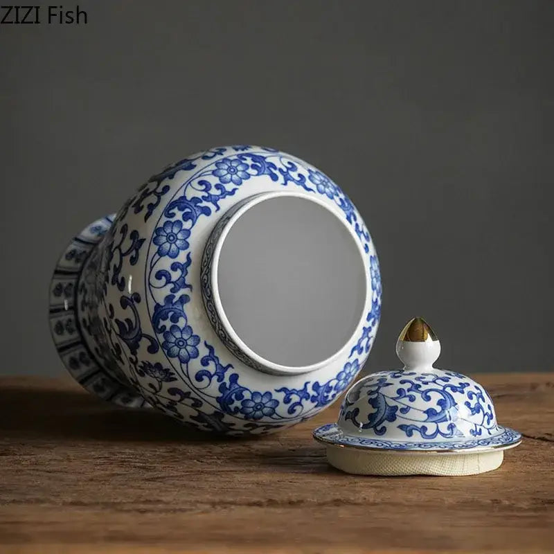 Blue and white porcelain jar with intricate floral patterns, gold plating, and matching lid for living room decor