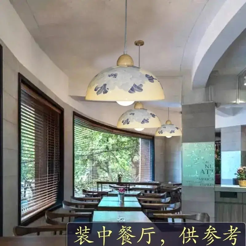 Cream-colored ceramic pendant chandelier with delicate purple butterfly decals for dining room decorbites blue white porcelain