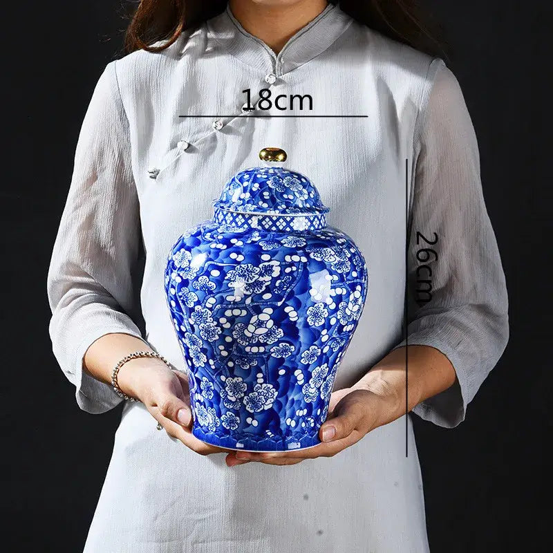 Blue and white porcelain pot sealed storage tank with intricate floral patterns and gold-colored lid for kitchen use