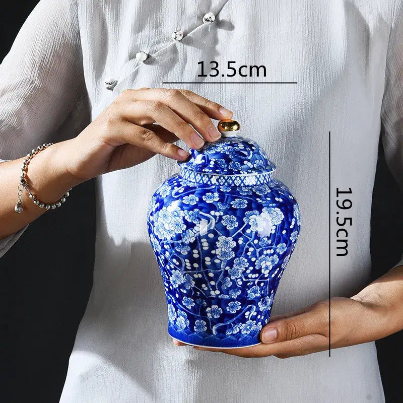 Blue and white porcelain pot sealed storage jar with intricate floral patterns and gold-toned lid for kitchen use