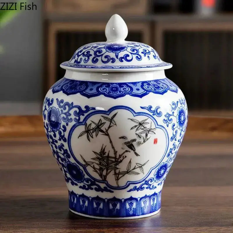 White porcelain tea canister with blue and black hand-painted bamboo birds and floral design for kitchen storage
