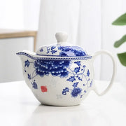 White porcelain tea pot set featuring intricate blue floral patterns and a matching lid with red seal mark