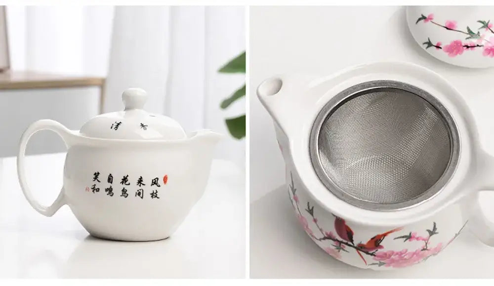 White porcelain tea pot set with pink cherry blossom and bird design featuring a metal infuser inside