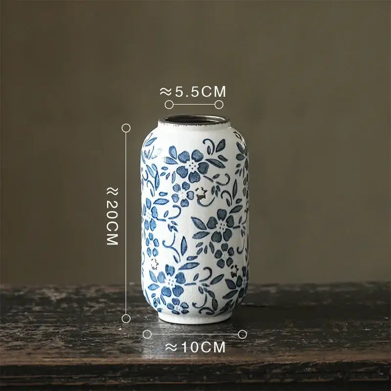 A white porcelain vase with delicate blue floral patterns and a rounded body for hydroponic living room decorbites blue white porcelain