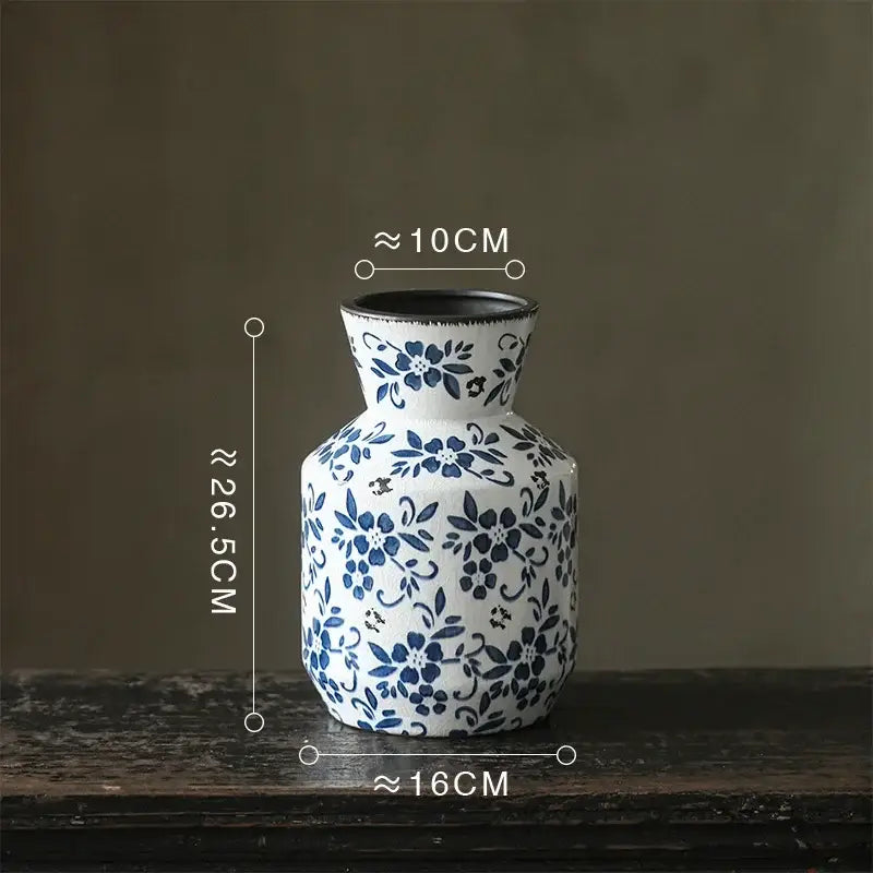 White porcelain vase with intricate blue floral patterns and black rim blue white porcelain decorbites hydroponic pot