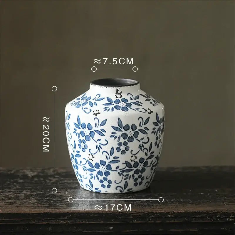 A blue white porcelain vase with intricate floral patterns and a flared rim, ideal as a decorbites white porcelain vase for hydroponic living room use